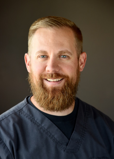 smiling-doctor-with-chin-on-hand-s